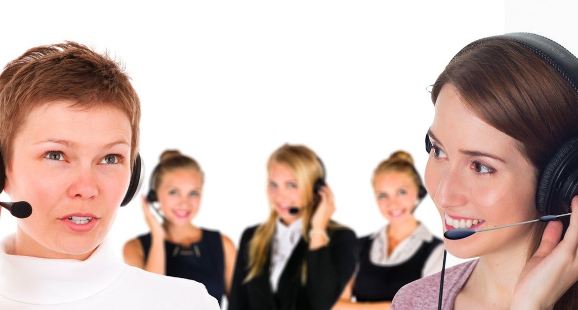 Business professional using a headset in a modern office, representing VoIP and CX tools in 2025