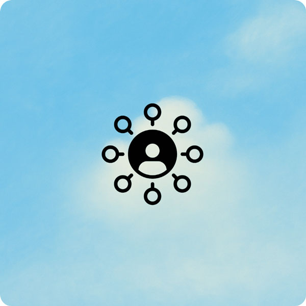 TeleCloud Multi-site - A black icon representing a central person or hub with eight smaller circles, some containing magnifying glass symbols, connected to it, against a soft, light blue background that resembles a cloudy sky.