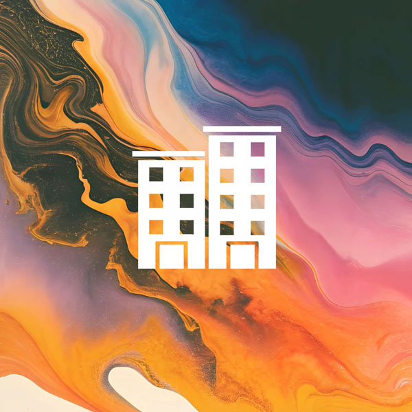 A white icon of two adjoining office or apartment buildings over a colorful background of swirling orange, pink, and yellow paint.